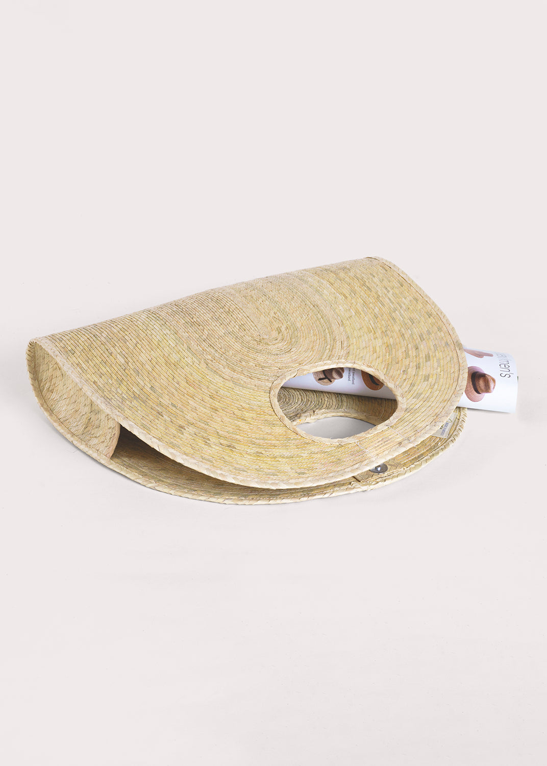 Light palm straw half-circle tote, hand-woven from natural palm fiber with inner magnet closure.